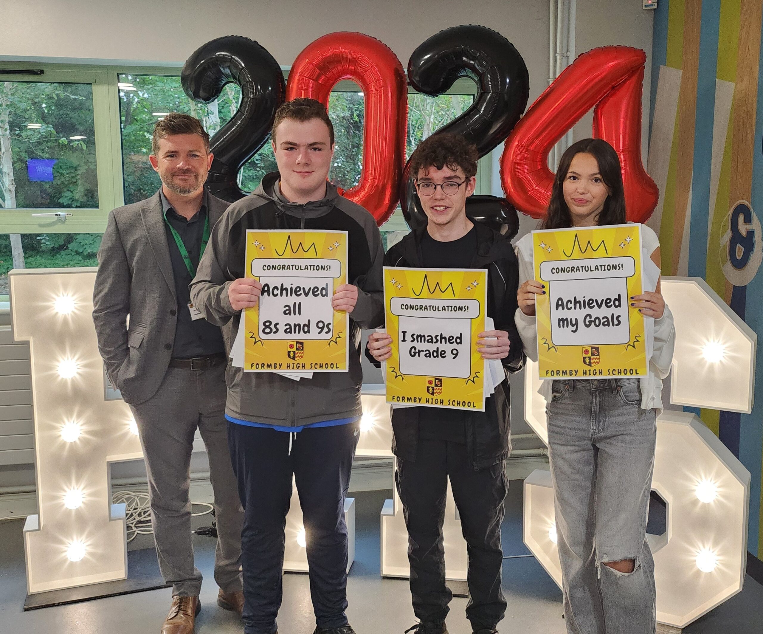 Headteacher with GCSE students